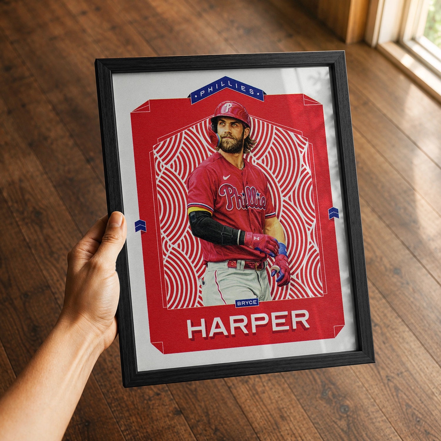 A premium Bryce Harper poster in a 8x10 frame being gifted to a Philadelphia Phillies fan.