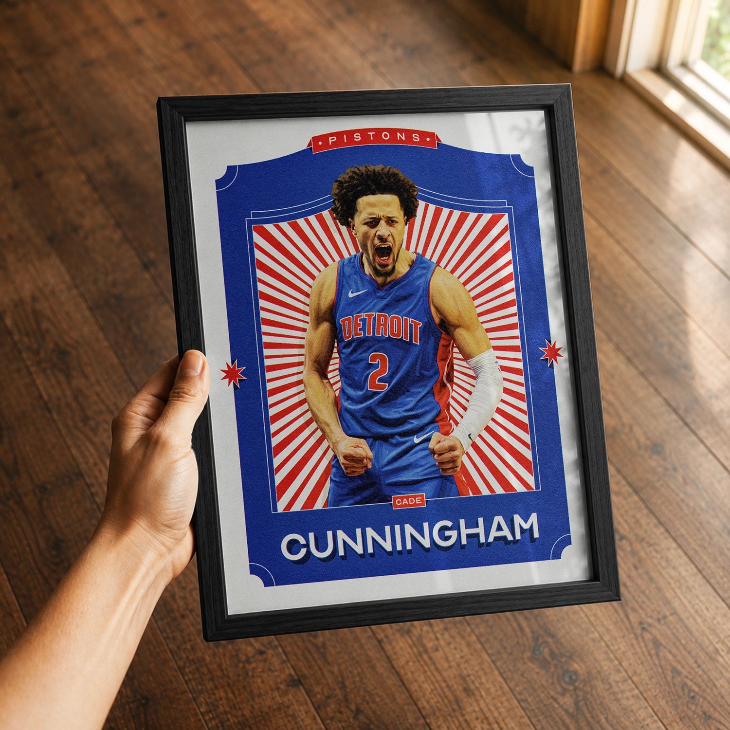 A premium Cade Cunningham poster in a 8x10 frame being gifted to a Detroit Pistons fan.