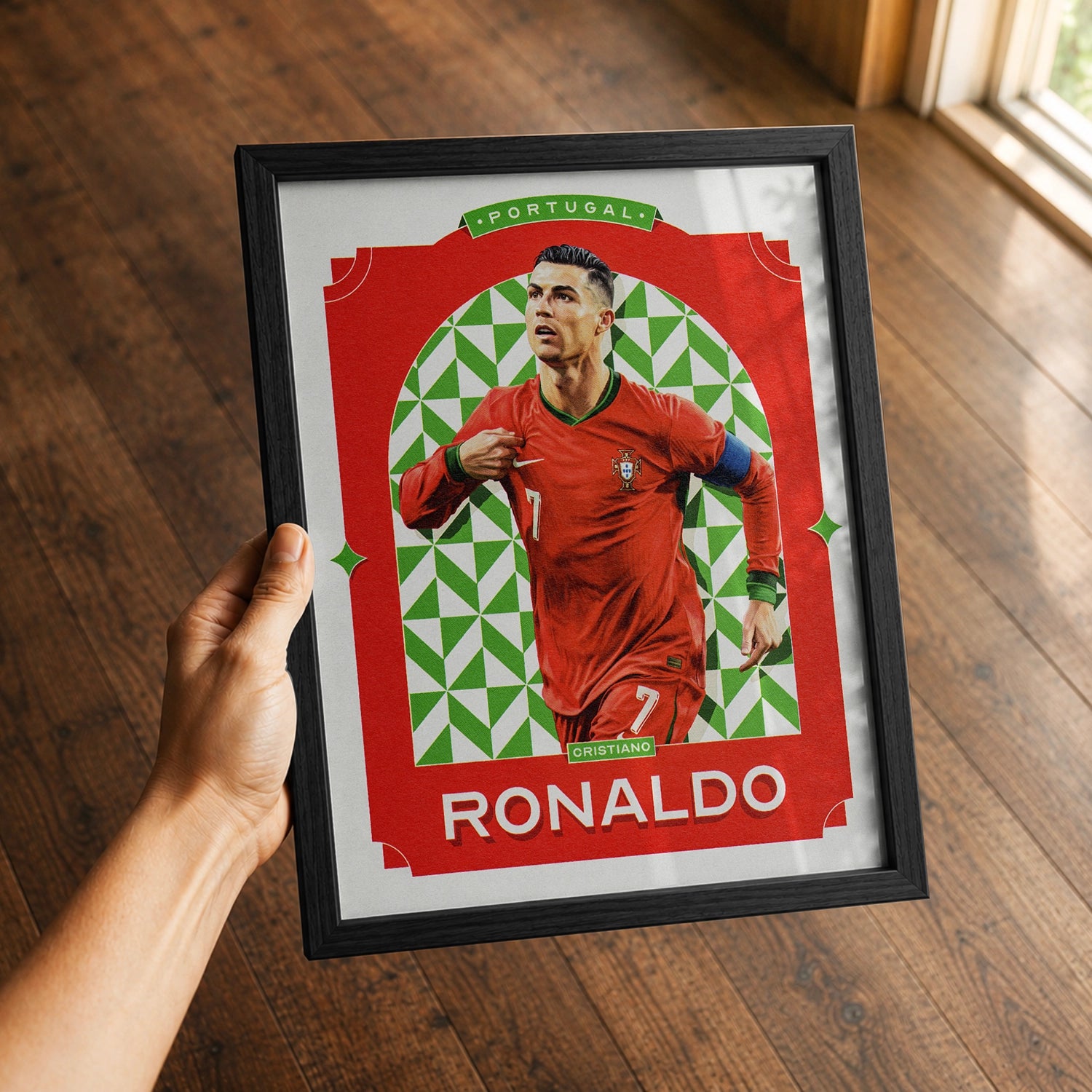 A premium Cristiano Ronaldo poster in a 8x10 frame being gifted to a Portugal fan.