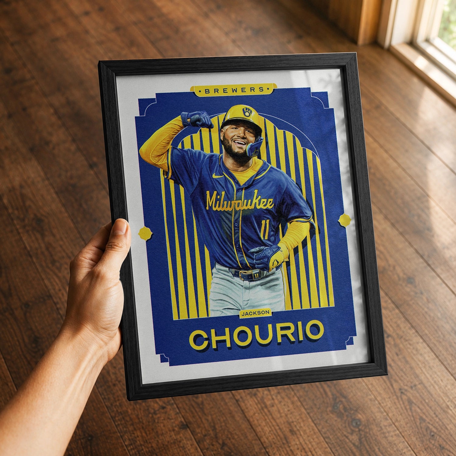 A premium Jackson Chourio poster in a 8x10 frame being gifted to a Milwaukee Brewers fan.