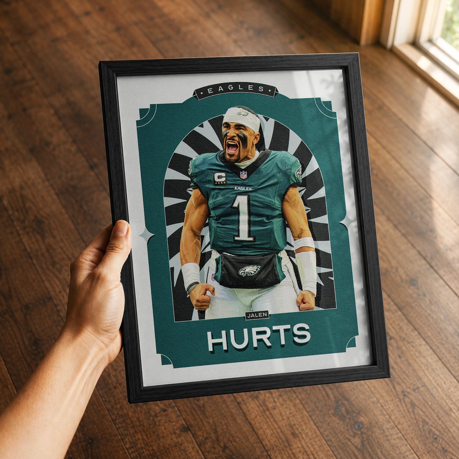 A premium Jalen Hurts poster in a 8x10 frame being gited to a Philadelphia Eagles fan.