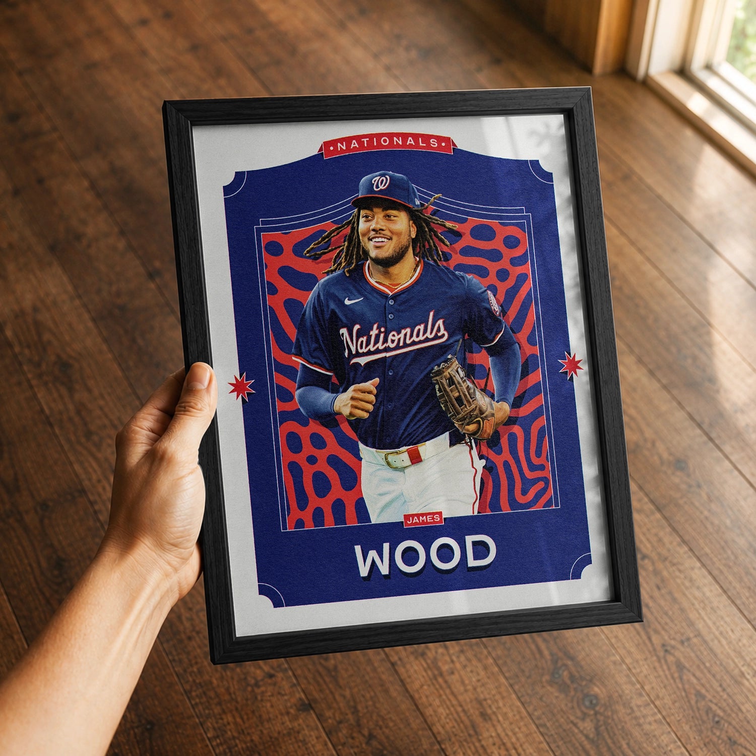 A premium James Wood poster in a 8x10 frame being gited to a Washington Nationals fan.