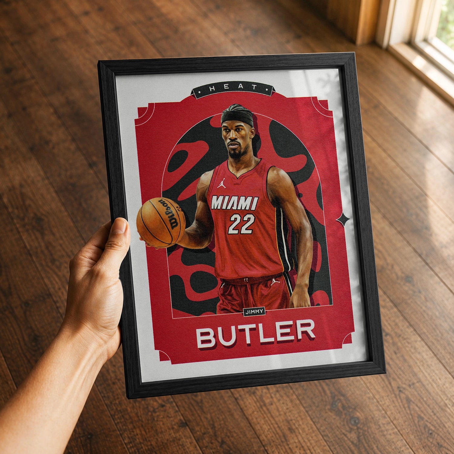 A premium Jimmy Butler poster in a 8x10 frame being gifted to a Heat fan.