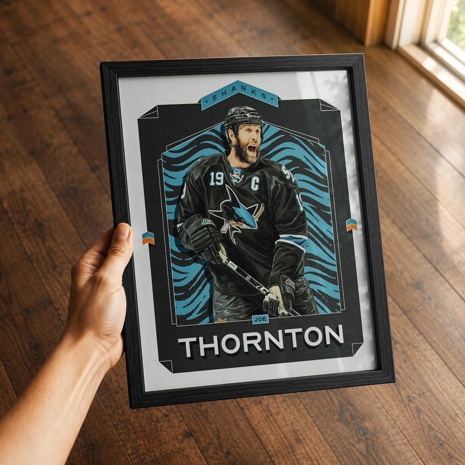 A premium Joe Thornton poster in a 8x10 frame being gifted to a San Jose Sharks fan.