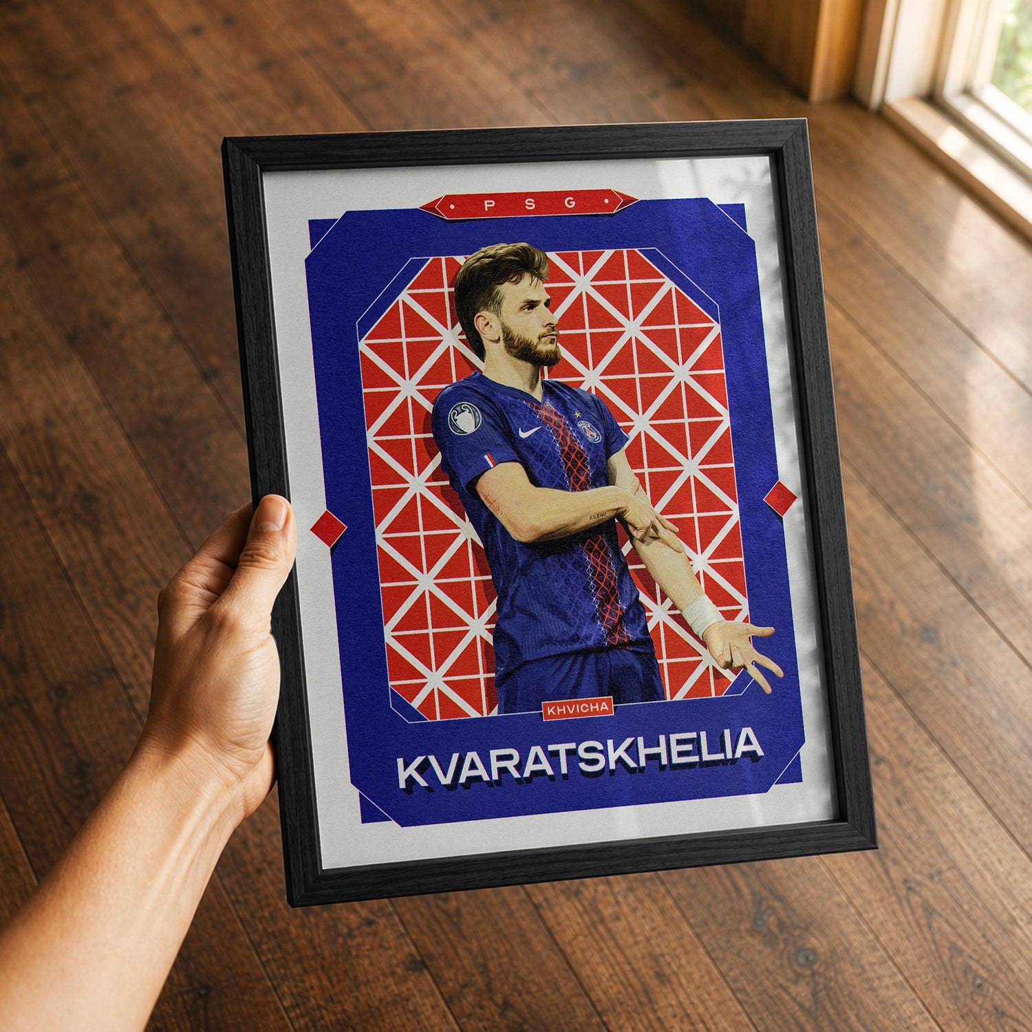 A premium Khvicha Kvaratskhelia poster in a 8x10 frame being gifted to a Paris Saint-germain fan.