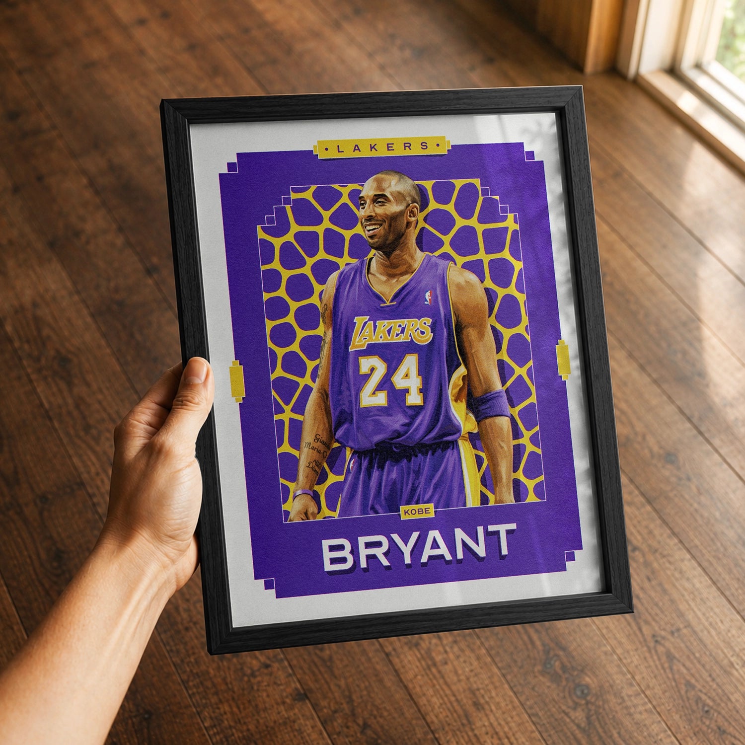 A premium Kobe Bryant poster in a 8x10 frame being gifted to a Los Angeles Lakers fan.