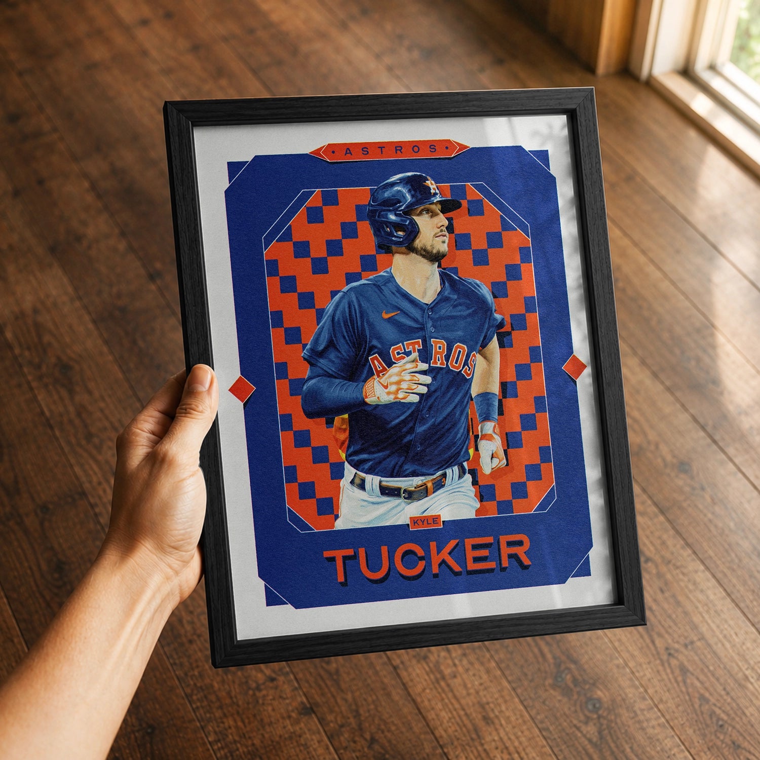 A premium Kyle Tucker poster in a 8x10 frame being gifted to a Houston Astros fan.
