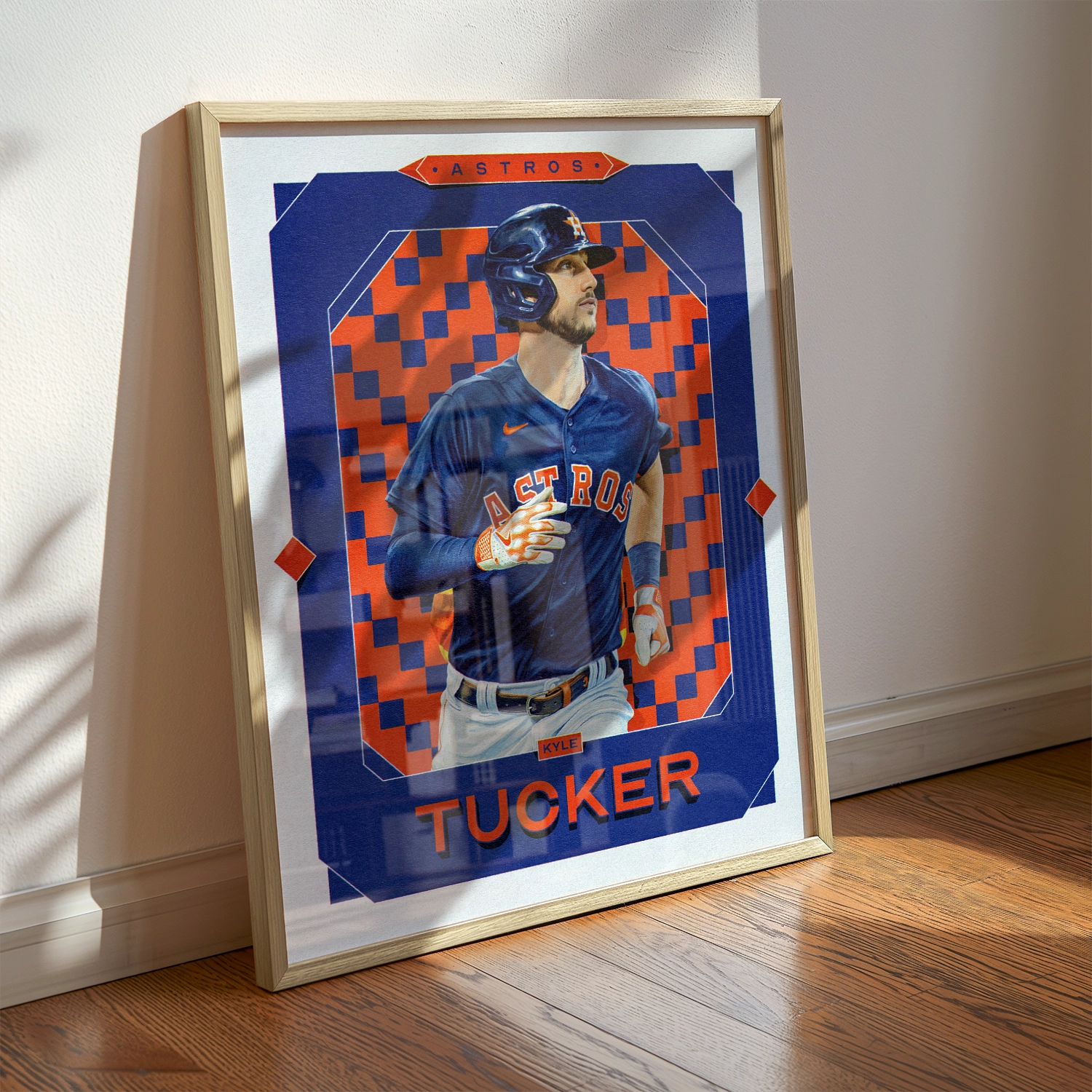 A Kyle Tucker poster displayed as modern sports wall art in the home of a Houston Astros fan.