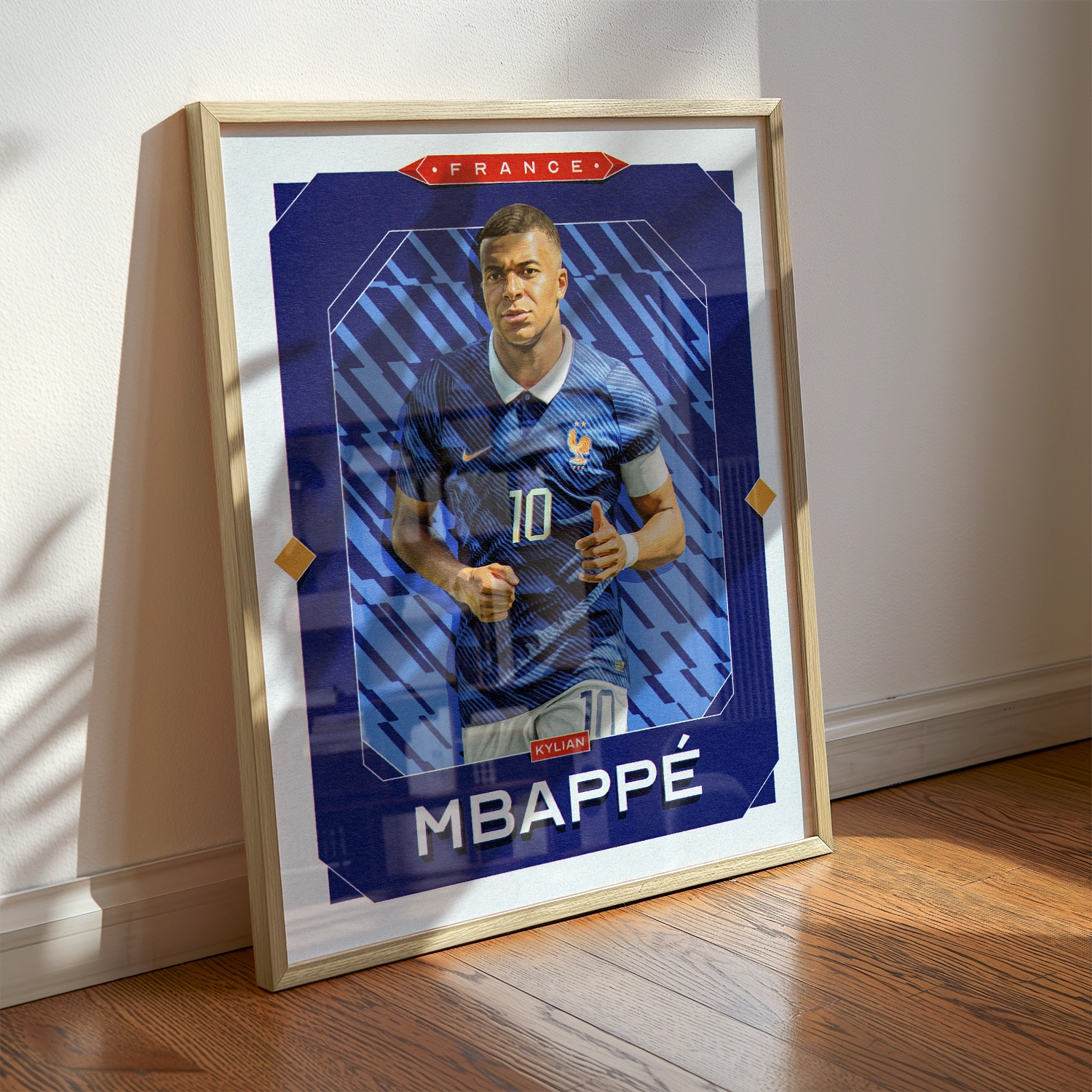A Kylian Mbappé poster displayed as modern sports wall art in the home of a France fan.