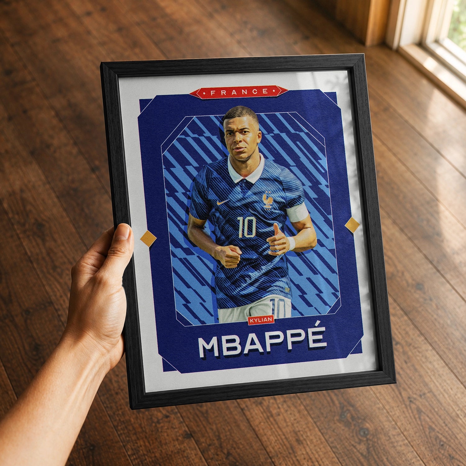 A premium Kylian Mbappé poster in a 8x10 frame being gifted to a France fan.