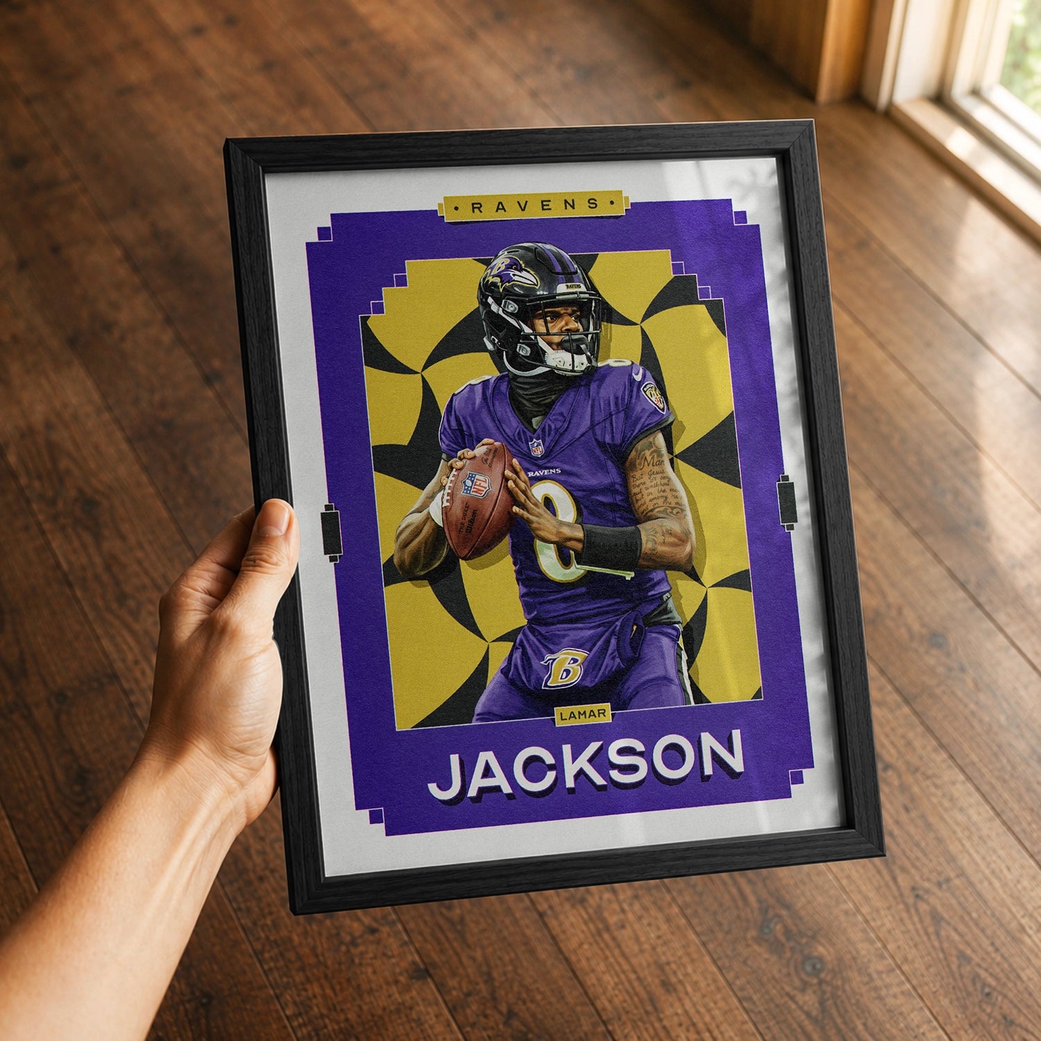 A premium Lamar Jackson poster in a 8x10 frame being gifted to a Baltimore Ravens fan.