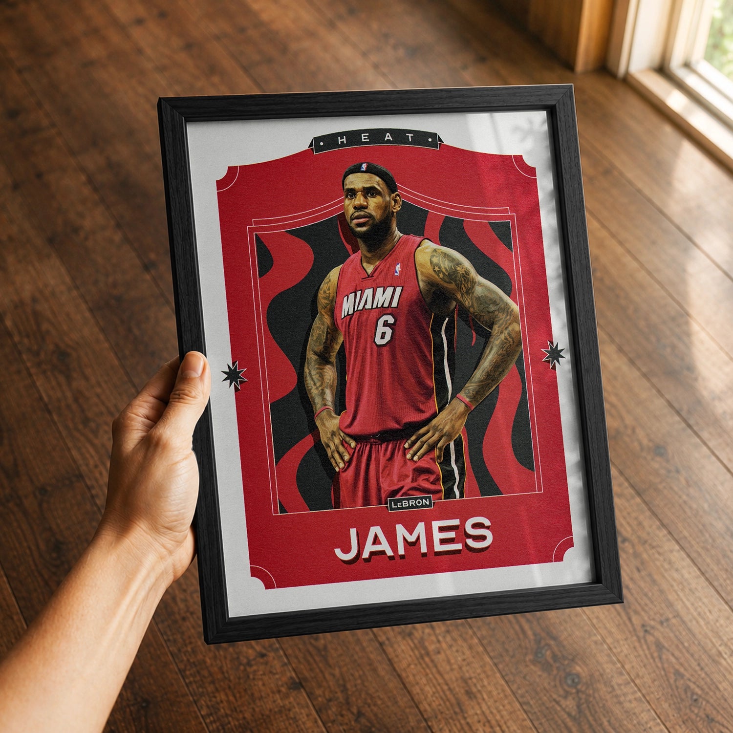 A premium LeBron James poster in a 8x10 frame being gifted to a Miami Heat fan.