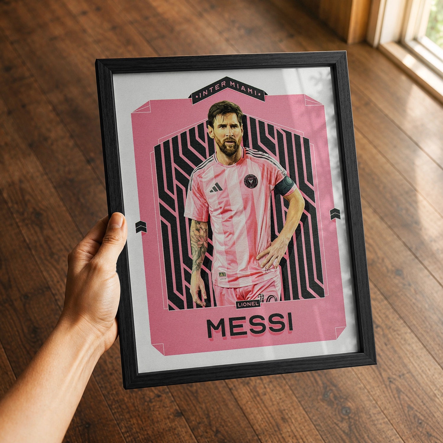 A premium Lionel Messi poster in a 8x10 frame being gifted to a Inter Miami fan.