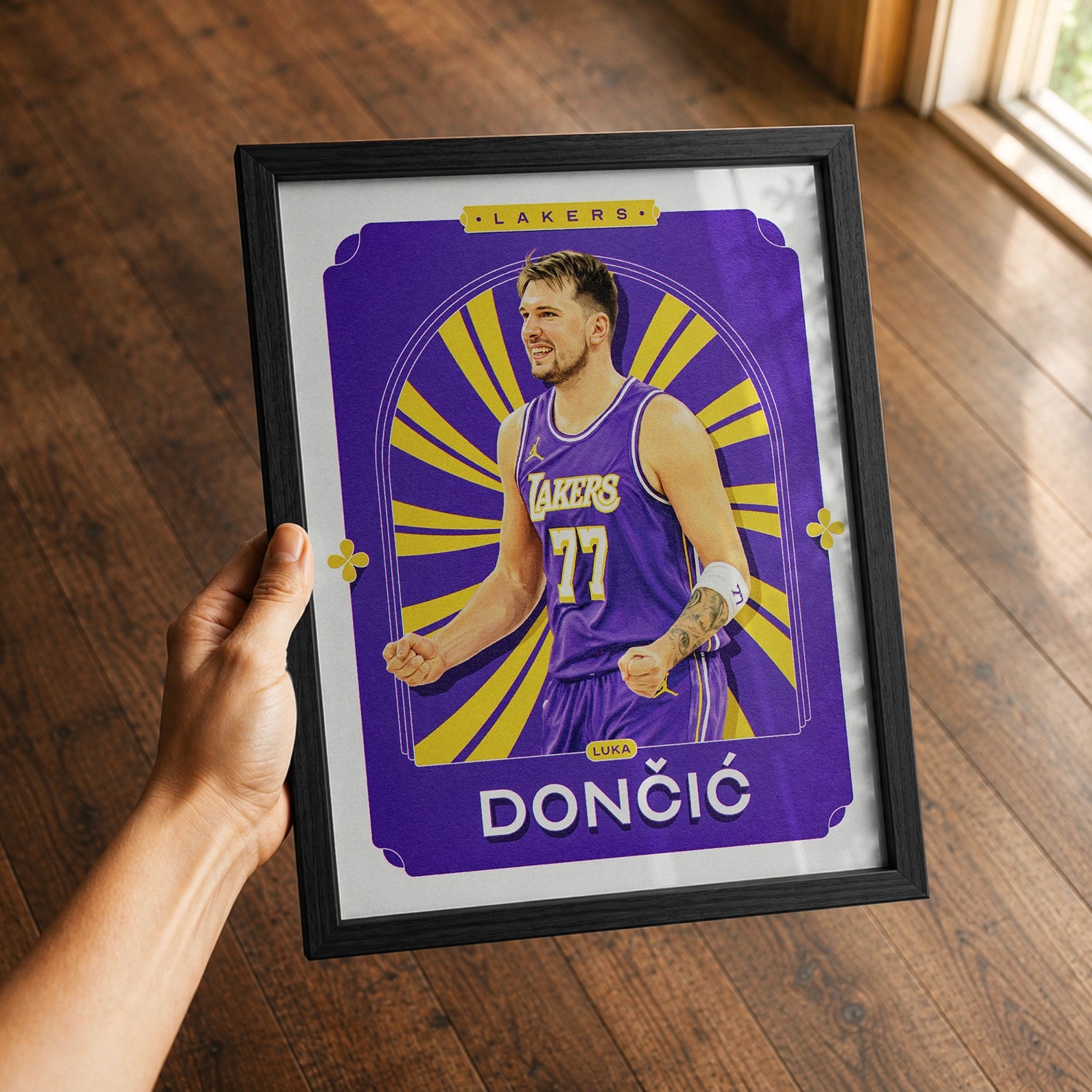 A premium Luka Doncic poster in a 8x10 frame being gifted to a Los Angeles Lakers fan.