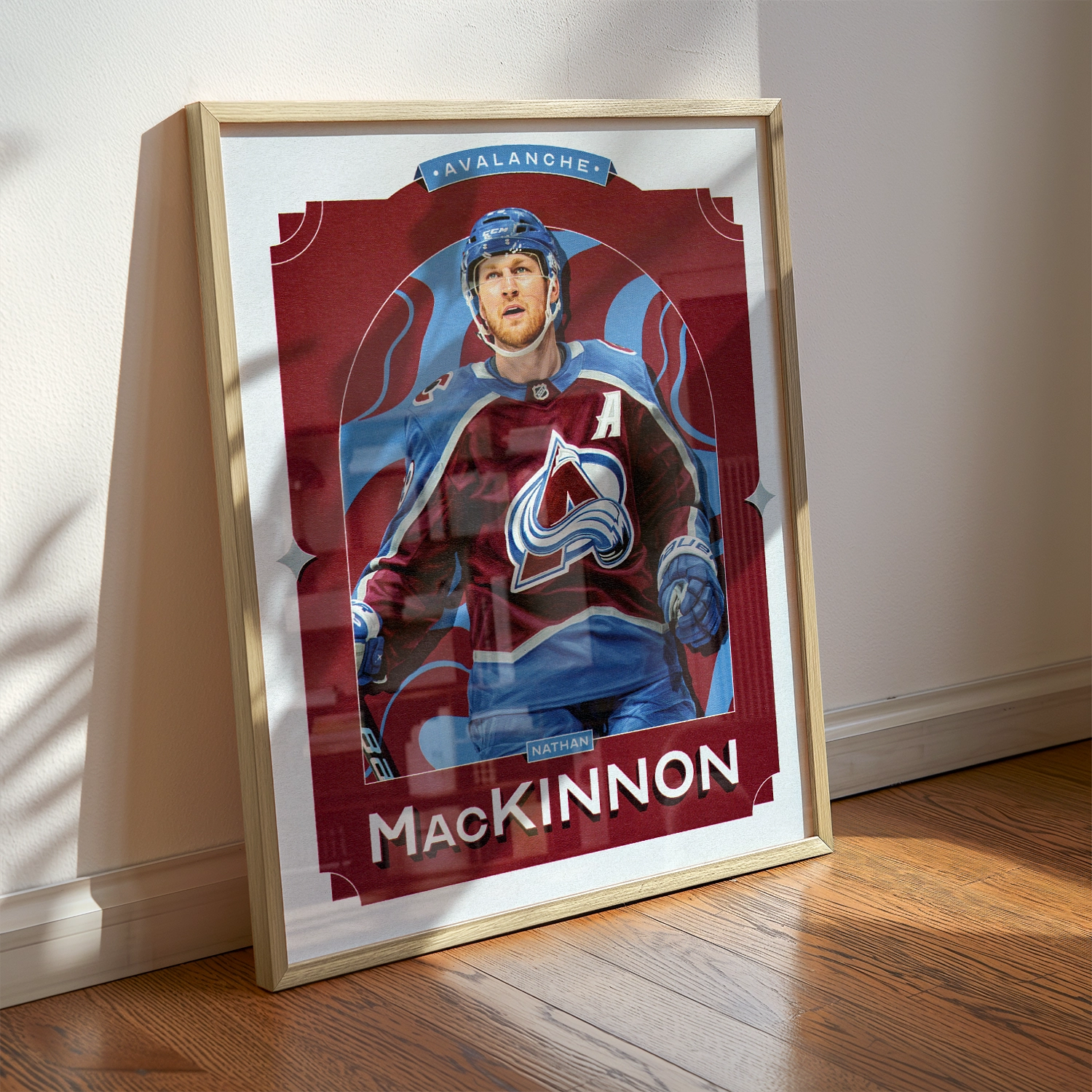 A Nathan MacKinnon poster displayed as modern sports wall art in the home of a Colorado Avalanche fan.