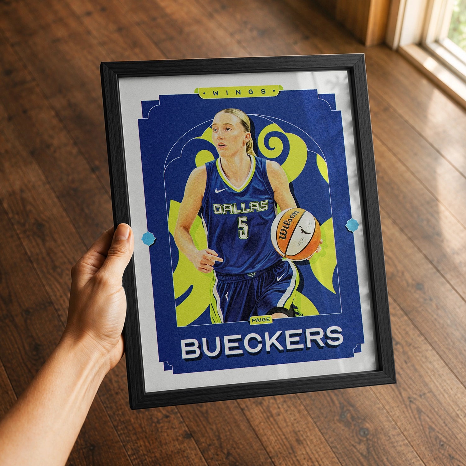 A premium Paige Bueckers poster in a 8x10 frame being gifted to a Dallas Wings fan.