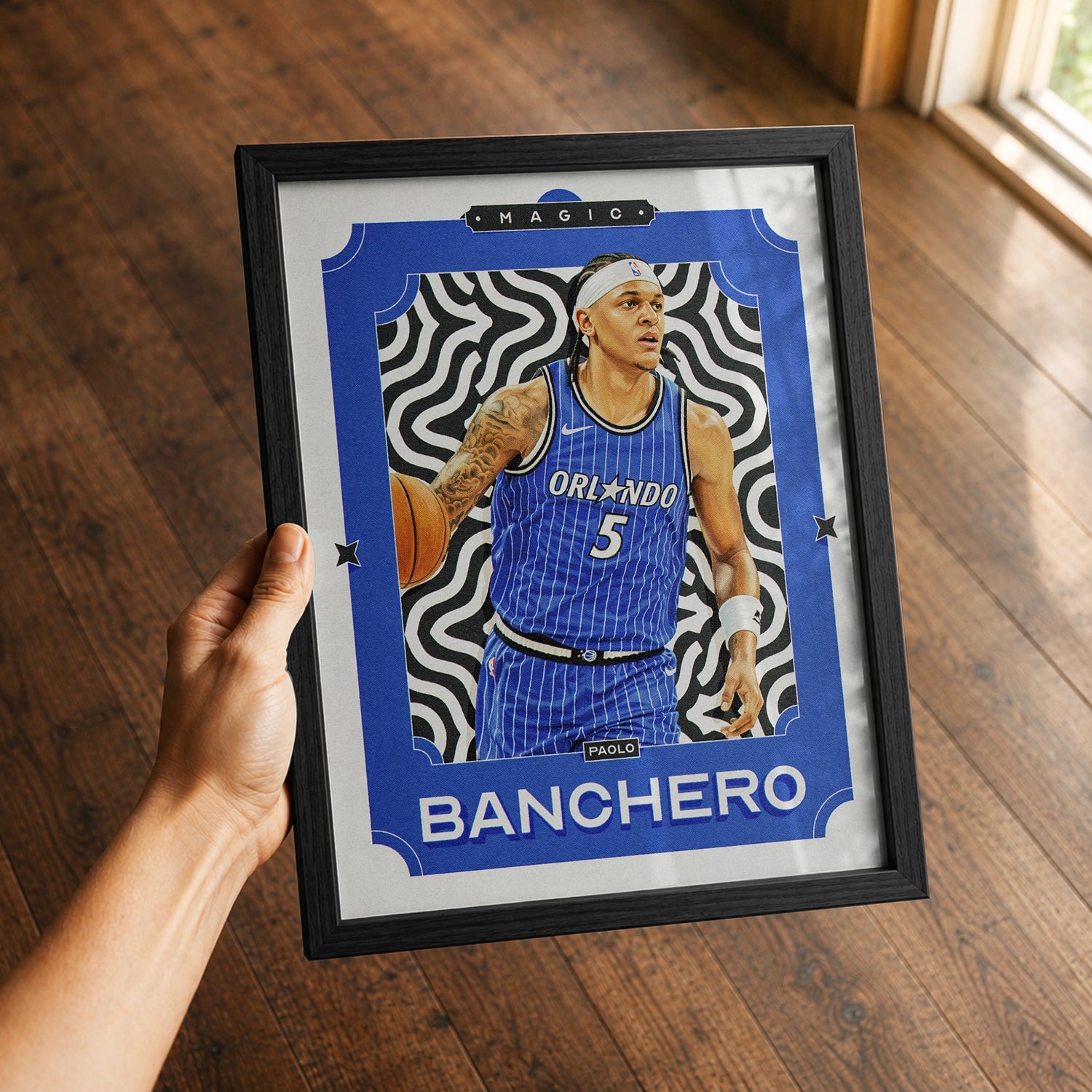 A premium Paolo Banchero poster in a 8x10 frame being gifted to a Orlando Magic fan.