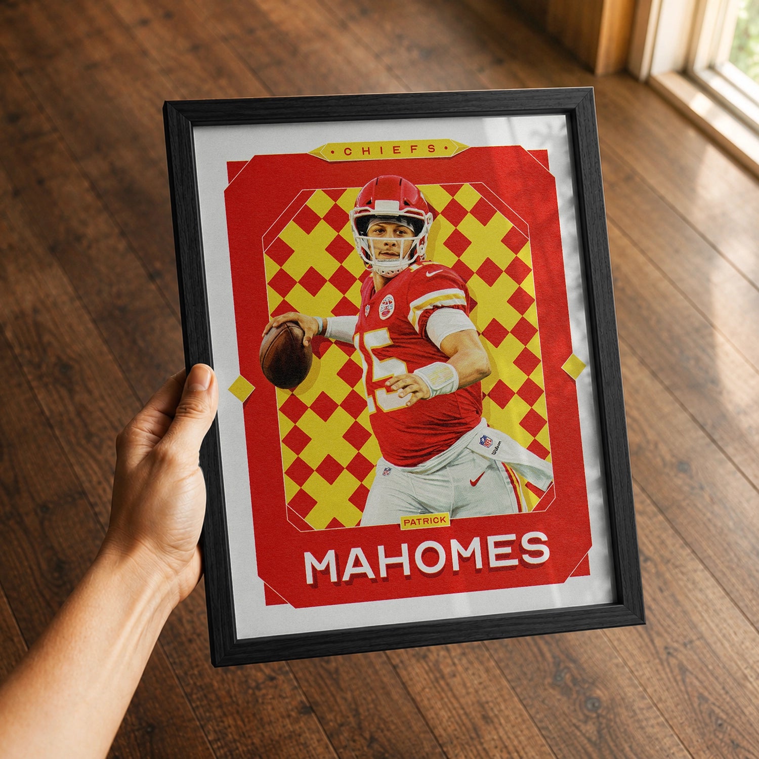 A premium Patrick Mahomes poster in a 8x10 frame being gifted to a Kansas City Chiefs fan.
