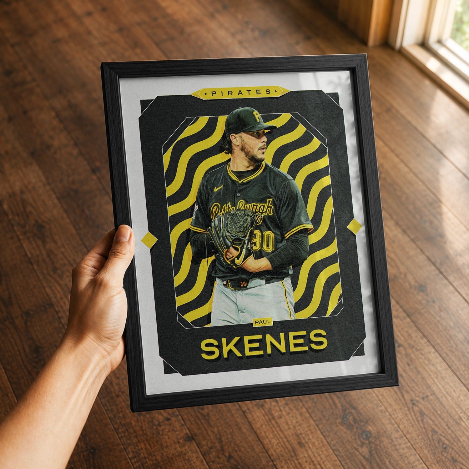 A premium Paul Skenes poster in a 8x10 frame being gifted to a Pittsburgh Pirates fan.