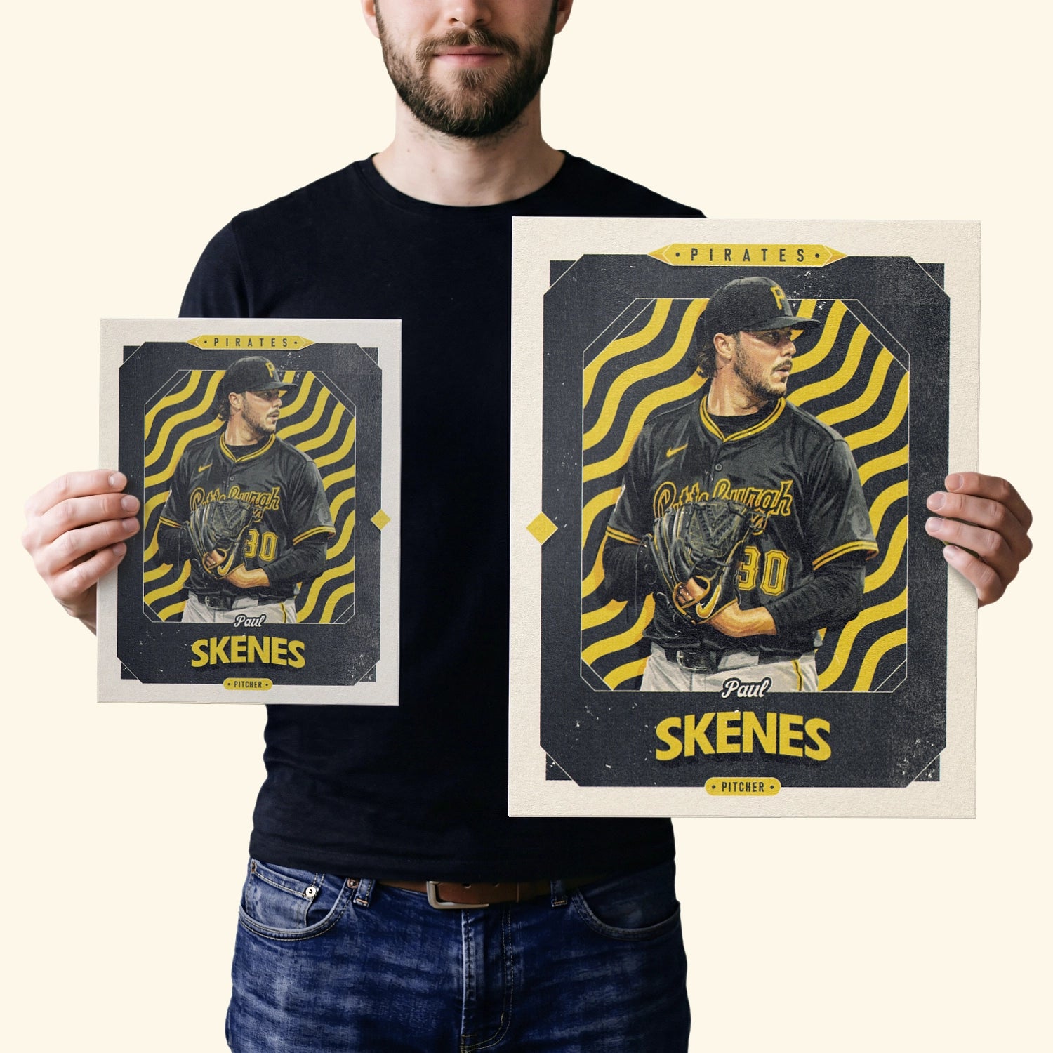 Two vintage inspired posters of Paul Skenes in the sizes 20x25cm or 8x10 inches and 40x50cm or 16x20 inches, held by a Pittsburgh Pirates fan.