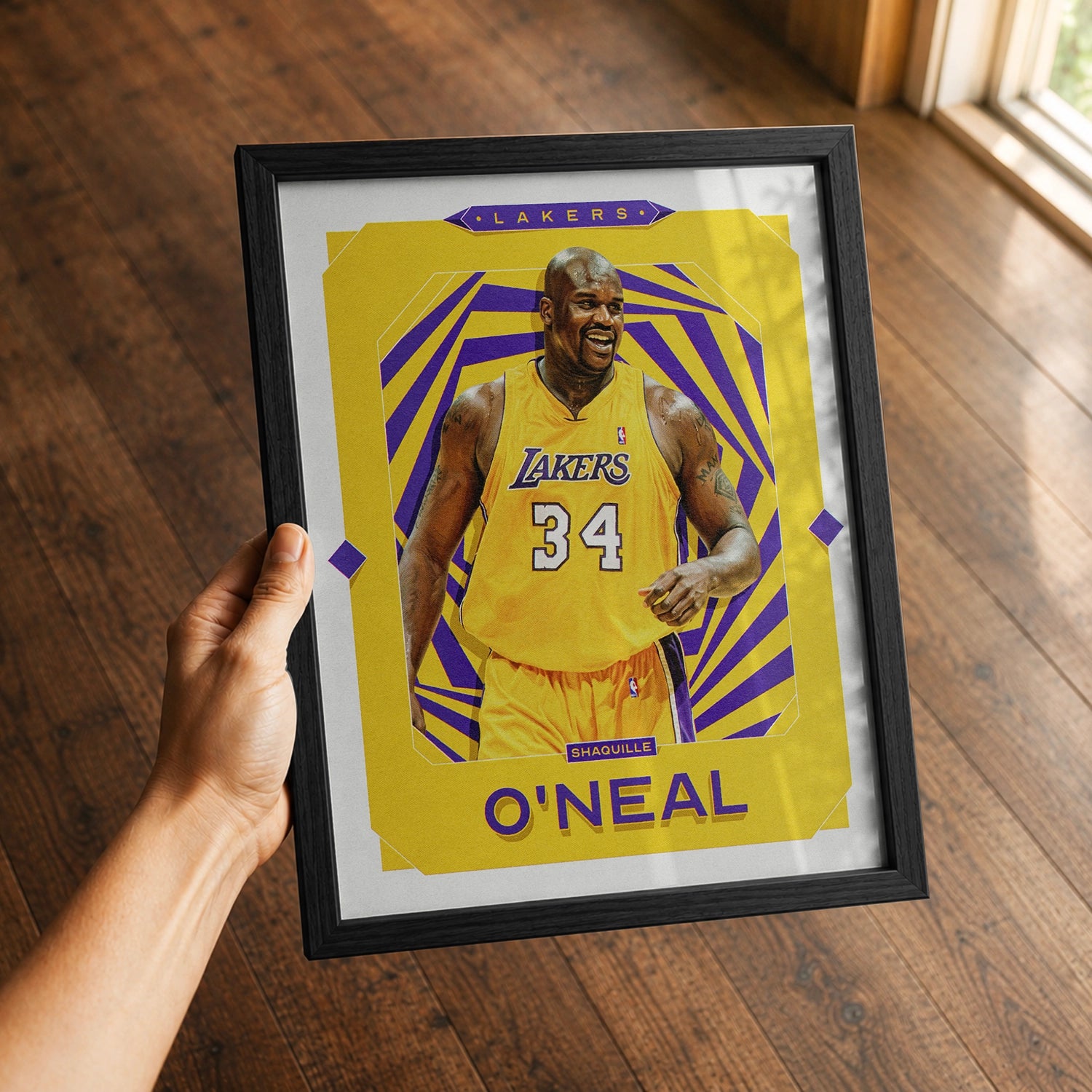 A premium Shaquille O'neal poster in a 8x10 frame being gifted to a Los Angeles Lakers fan.