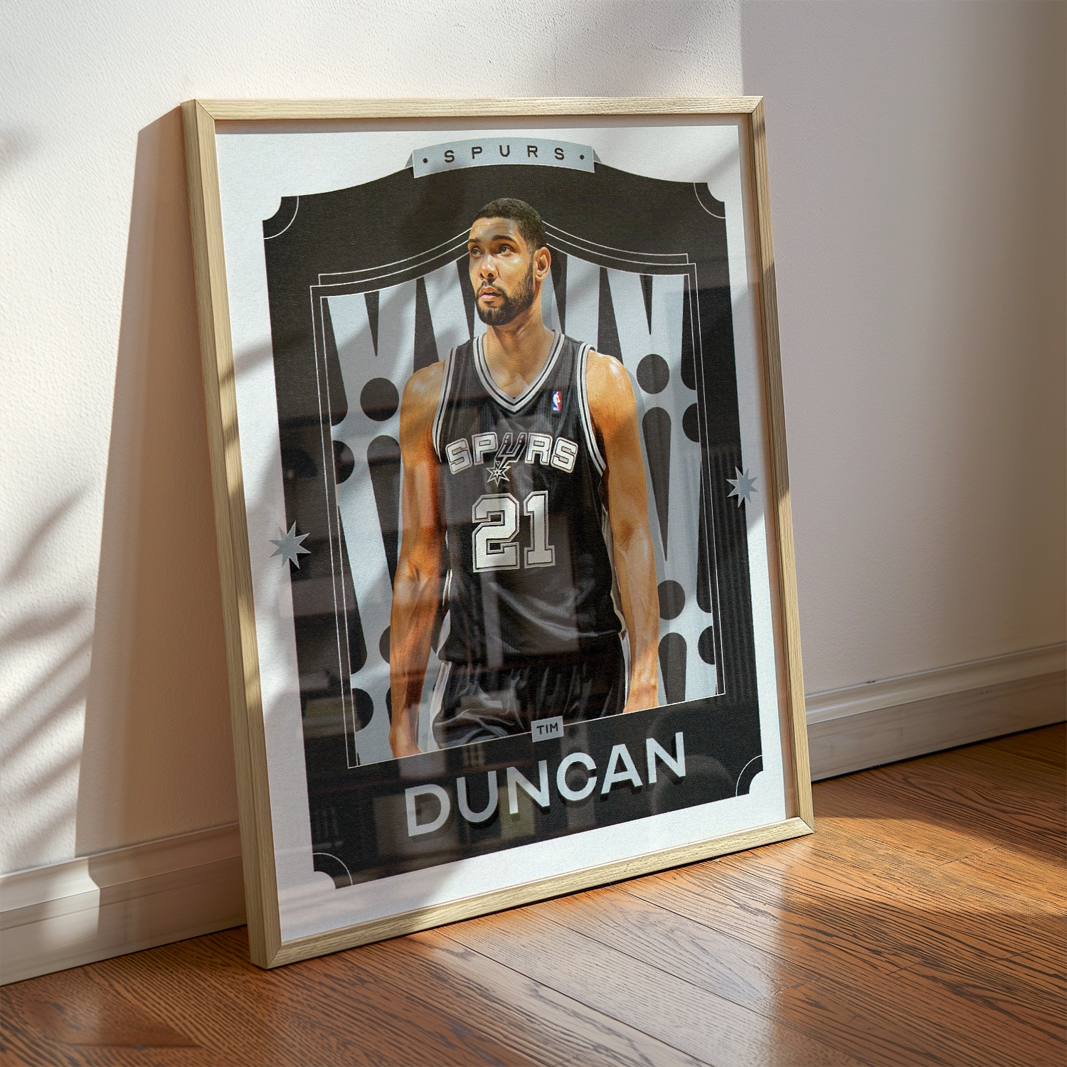 A Tim Duncan poster displayed as modern sports wall art in the home of a San Antonio Spurs fan.