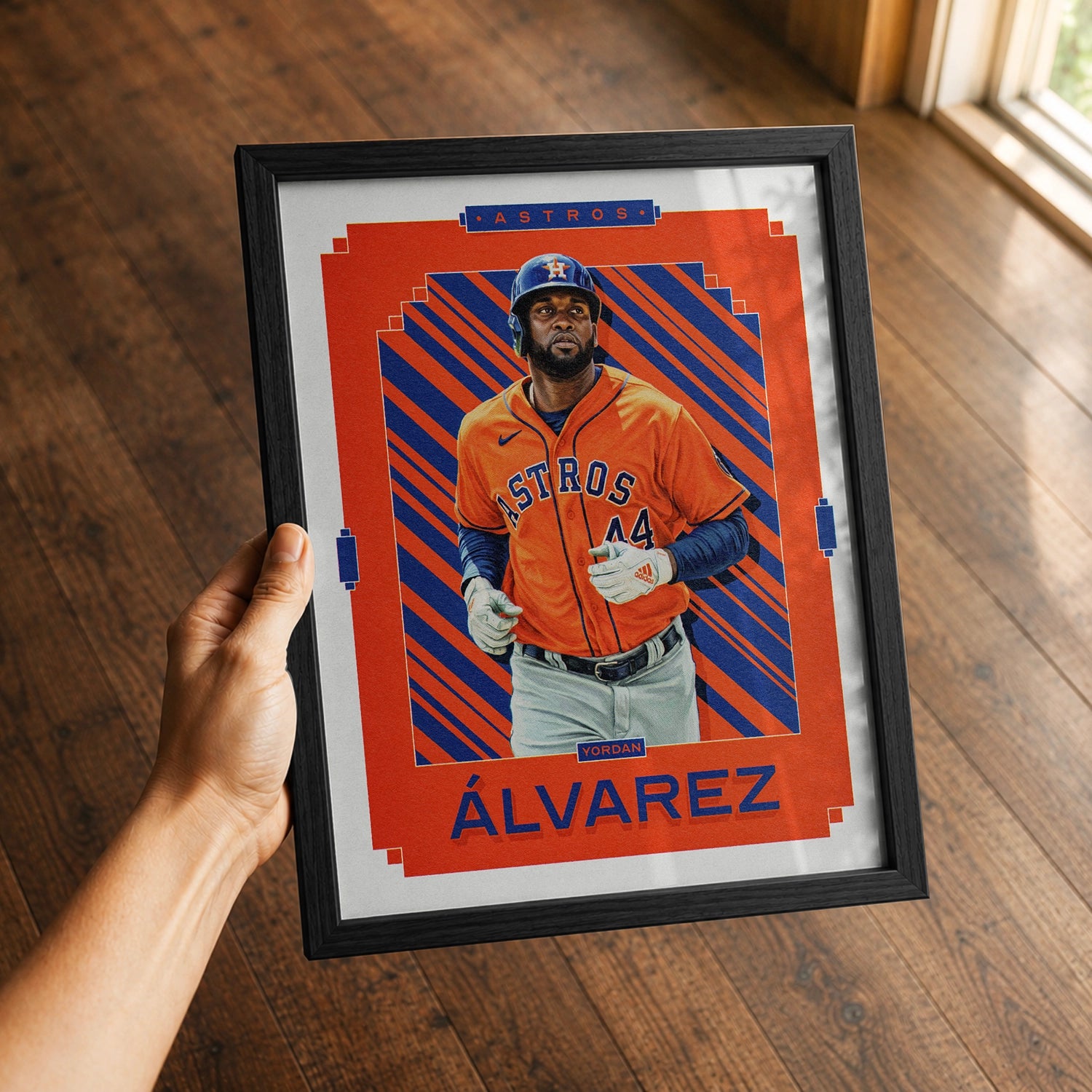 A premium Yordan Alvarez poster in a 8x10 frame being gifted to a Houston Astros fan.